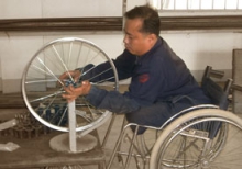 Amputee making a wheelchair.